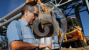 Architect or Engineer With Laptop Computer on the Construction Site