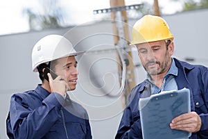 architect and engineer talking on construction site