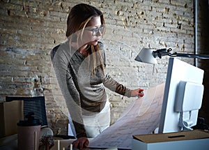 Architect engineer woman working plan at office