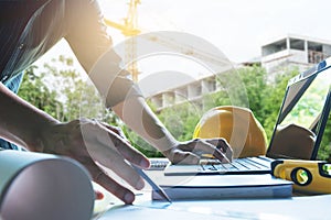 Architect engineer working concept and construction tools or safety equipment on table.