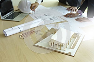 architect or engineer working on table show work hand
