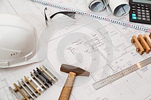 Architect or engineer workplace with drawings and tools