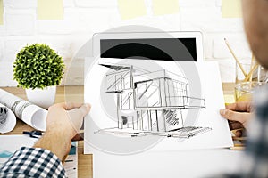 Architect evaluating project