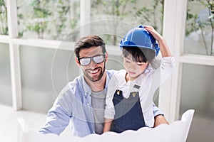 Architect father and his child girl working together at home,Laughing and funny,Happy loving family