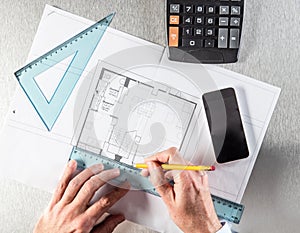 Architect hands making measurements, working at desk for construction concept