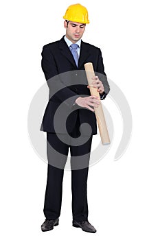 An architect holding plans