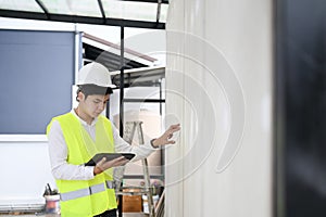 Architect man checking insulation house construction.