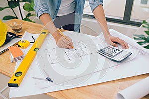 architect man working with laptop and blueprints,engineer inspection in workplace for architectural plan,sketching a construction