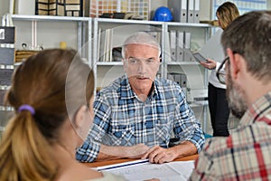 Architect meeting with young couple