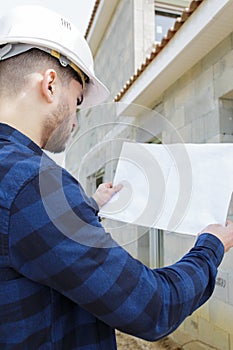 architect outdoors working construction site concept