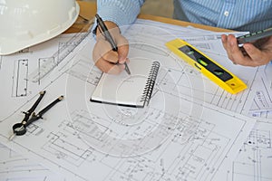 Architect or planner working on drawings for construction plans