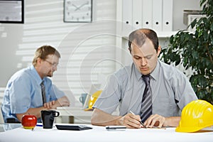 Architect planning at desk