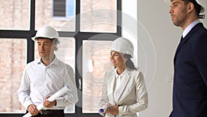 Architect or realtor showing office to customers