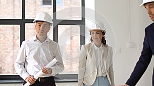 Architect or realtor showing office to customers