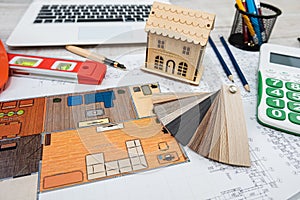 architect with rolls and technical project drawing plan. Top view of engineering tools.