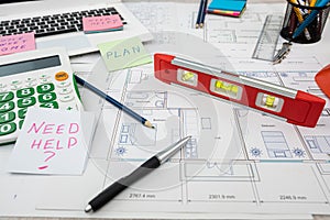 architect with rolls and technical project drawing plan. Top view of engineering tools.