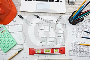 architect with rolls and technical project drawing plan. Top view of engineering tools.