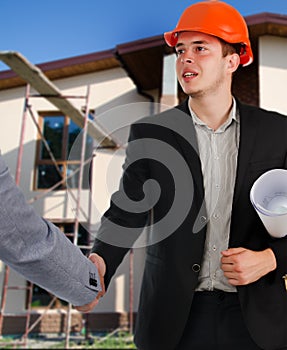 Architect shaking hands with a client