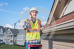 Architect standing on a ladder.