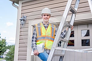 Architect standing on a ladder.