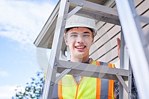 Architect standing on a ladder.