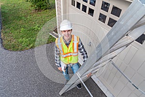 Architect standing on a ladder.