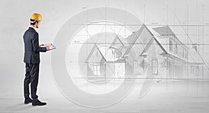 Architect standing with house plan
