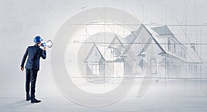 Architect standing with house plan