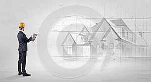 Architect standing with house plan