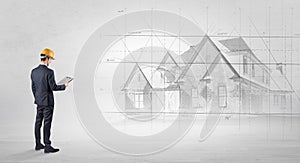 Architect standing with house plan