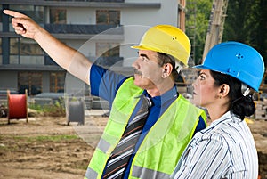 Architect team on site pointing