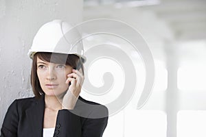 Architect Using Cell Phone In Empty Warehouse