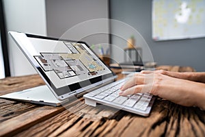 Architect Using Laptop In Office