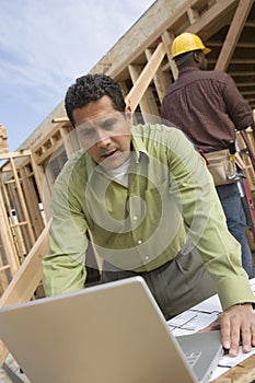 Architect Using Laptop At Site