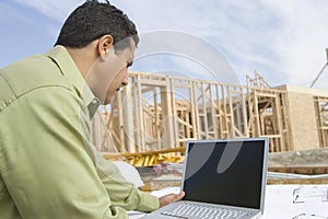 Architect Using Laptop At Site