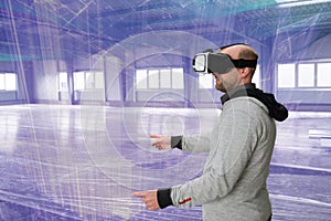 Architect with VR visor exploring industrial building environment