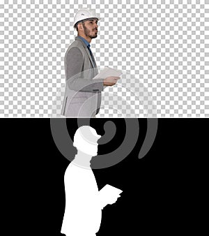 Architect walking with tablet and checking what is built, Alpha