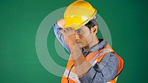 An architect wearing a yellow hard hat before starting his work