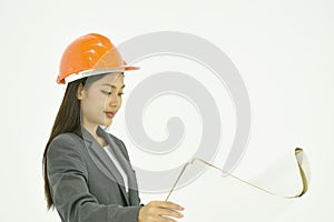 Architect woman wearing colorful helmet looking blue print for work in whitre background