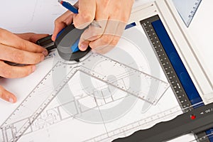 Architect working on architectural plans