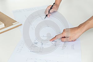 Architect working on blueprint, Engineer meeting working with pa