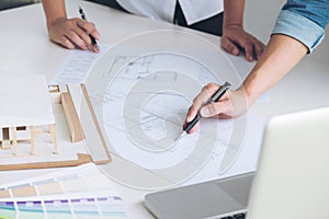 Architect working on blueprint, Engineer meeting working with pa photo