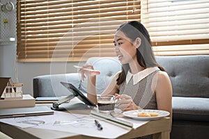 Architect working with computer tablet in living room.