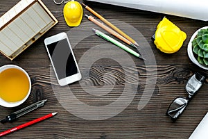 Architect working desk on wooden background top view mock-up