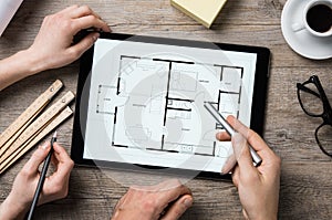 Architect working on digital tablet