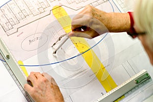 Architect working on drawing board