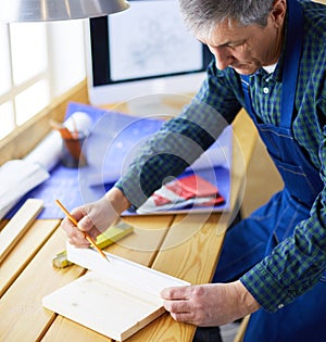 Architect working on drawing table in office