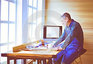 Architect working on drawing table in office