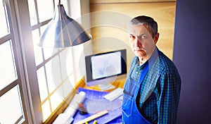 Architect working on drawing table in office