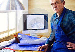 Architect working on drawing table in office